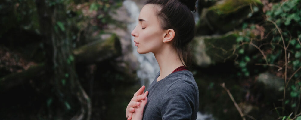 Young,Woman,Practicing,Breathing,Yoga,Pranayama,Outdoors,In,Moss,Forest